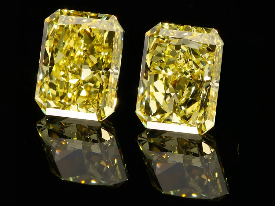 Pair of fancy yellow radiant diamonds
